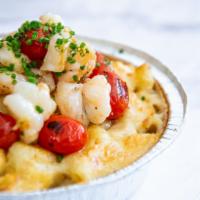 Lobster Mac · Fresh lobster sauteed in garlic butter with grape tomatoes, all on a garlic Goddess mac. Exc...
