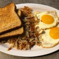 2 Eggs Breakfast · Served with hash browns and toast.