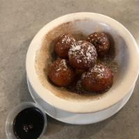 Homemade Donuts · Served with powdered sugar, cinnamon and honey.