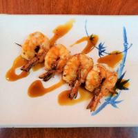 Shrimp Skewer · Four skewered shrimp grilled and seasoned