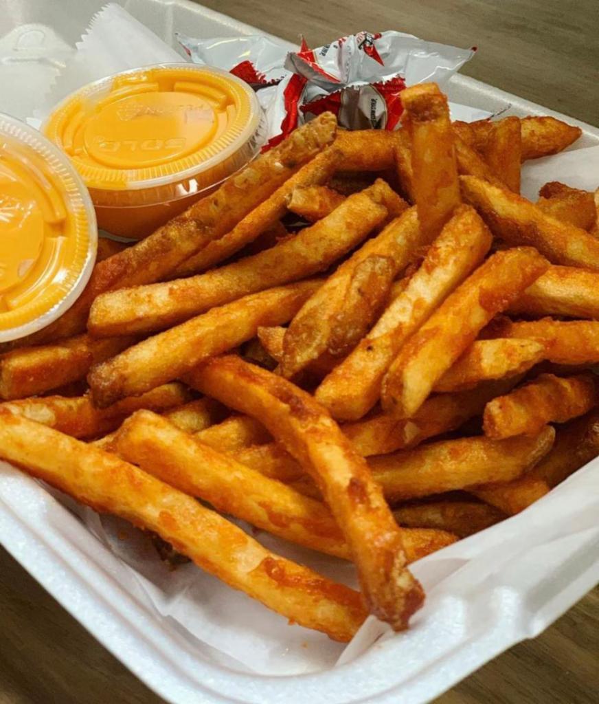 Cheese Fries · Seasoned quality french fries with cheese on the side.