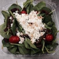 Spinach and Apple Salad · Fresh sliced apples, cranberries, feta cheese and walnuts over baby spinach. Served with pit...