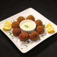 Falafel · Ground chickpeas with parsley, onions Served with tahini and hot sauce.