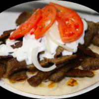 Gyro Sandwich with Fries · served with tomatoes, onions, tzatziki sauce, and fries.