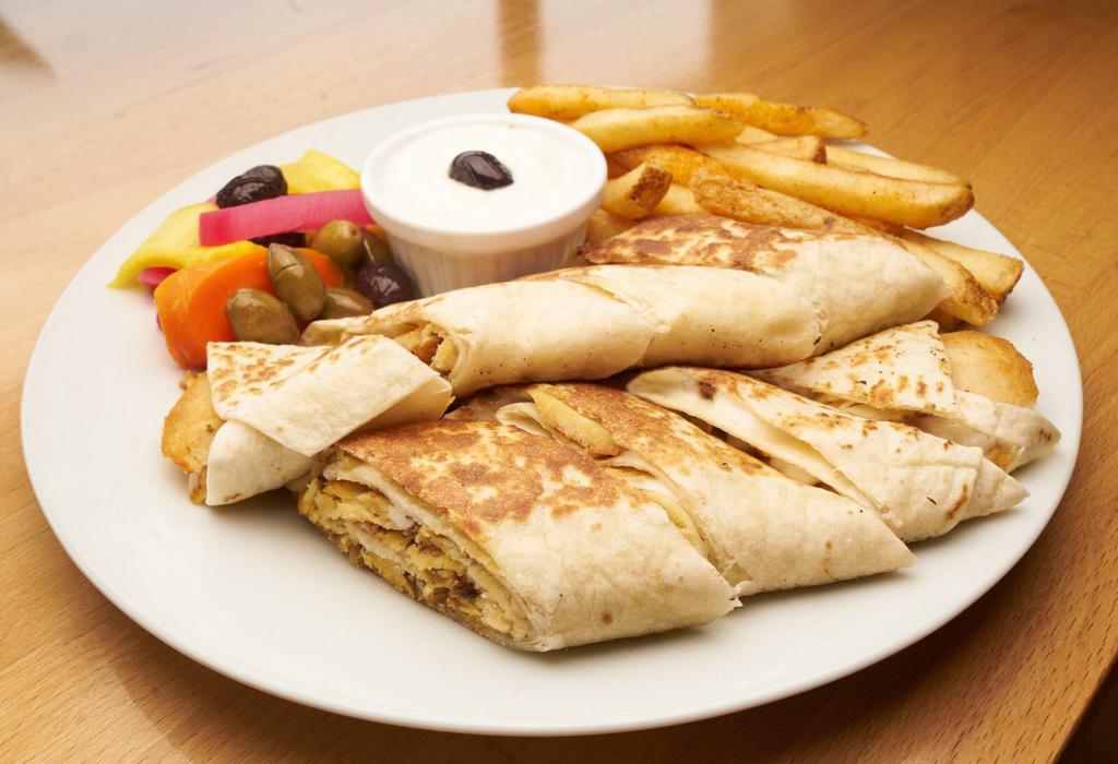 Chicken Shawarma Special with Fries · Thinly sliced chicken pieces marinated for a perfect taste topped with tomatoes, pickles, and garlic sauce served with fries.