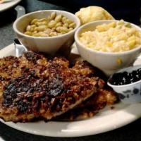 Pecan Pork Chops · Comes with blueberry chutney. Served with 2 sides.