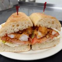 Shrimp Po’ Boy Sandwich · Shaved iceberg, tomato, remoulade.