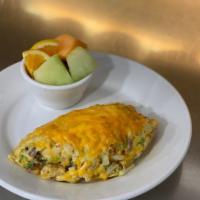 BAKED POTATO OMELETTE · Bacon, Hash Browns, Scallion, Sour Cream, Topped with Monterey Jack & Cheddar. Served w/ Fru...
