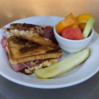 REUBEN SANDWICH · Corned Beef, Sauerkraut, Thousand Island & Swiss on Marble Rye. Served with Fries or Soup