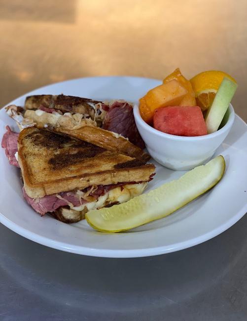 REUBEN SANDWICH · Corned Beef, Sauerkraut, Thousand Island & Swiss on Marble Rye. Served with Fries or Soup