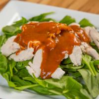 21. Swimming Rama · Your choice of protein sauteed on a bed of spinach and topped with peanut sauce.