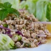 27. Larb Salad · Your choice of ground chicken, pork or beef tossed with toasted chili pepper, roasted rice, ...