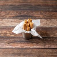 Churros · Sweet pastry deep fried with cinnamon and honey served with whipped cream strawberry and cho...