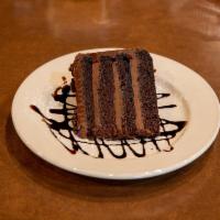 Truffle Chocolate Cake · Our colossal chocolate cake is layers of dark, moist chocolate cake with silky truffle choco...