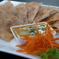 1. Roti · Roti bread served with yellow curry sauce.