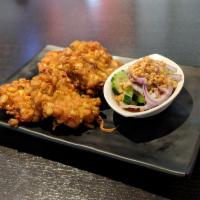 4. Corn Cake · Fried corn cake blended with curry paste, green beans and kaffir lime leaf.