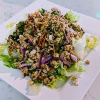 19. Larb Chicken Salad · Ground chicken with rice powder and lime juice.
