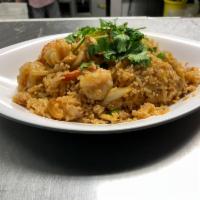49. Pineapple Fried Rice · Pan-fried rice with pineapple, egg, carrot, onion, cashew nut, chicken and prawn.