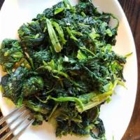 Sauteed Spinach · with garlic and extra virgin olive oil.
