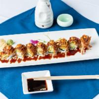 Scorpion Roll · Shrimp tempura, avocado and cucumber inside topped with potato strings. Cooked.