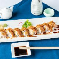 Shaggy Dog · Shrimp tempura, crabmeat inside. Topped with kani and eel sauce. Cooked.