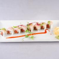 Pacific Roll · Raw. Spicy tuna, cucumber inside. Topped with yellowtail, ponzu sauce and micro green. 