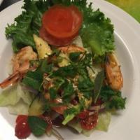18. Shrimp Salad  · Prawns tossed in lime juice, tomato, celery, cucumber, onion, cilantro, and mint leaves in f...