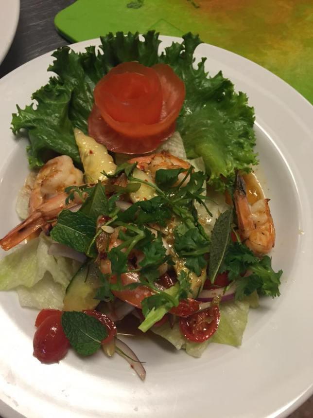 18. Shrimp Salad  · Prawns tossed in lime juice, tomato, celery, cucumber, onion, cilantro, and mint leaves in fresh homemade lime dressing served over a bed of salad greens.