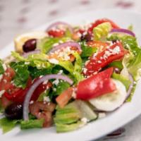 Signature Greek Salad · Fresh romaine lettuce, vine-ripened tomatoes, feta cheese, sliced cucumbers, red onions, Kal...