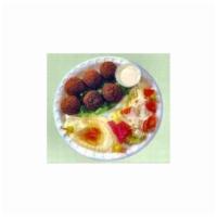 Falafel Plate · 6 piece mixture of garbanzo beans, parsley and fried in vegetable oil. Served with rice, hum...