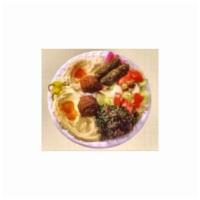 Vegetarian Combo · Hummus, eggplant, stuffed grape leaves, tabbouleh green salad and 2 pieces of falafel. 