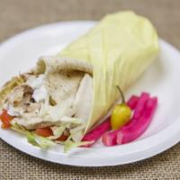 Rotisserie Chicken Sandwich · Served in pita bread with lettuce, tomatoes and onions. 