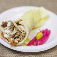 Chicken Shawerma Sandwich · Served in pita bread with lettuce, tomatoes and onions. 