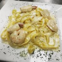 Fettuccine Alfredo with Shrimp · Alfredo sauce and shrimp over fettuccine pasta.  Served with salad and homemade rolls.