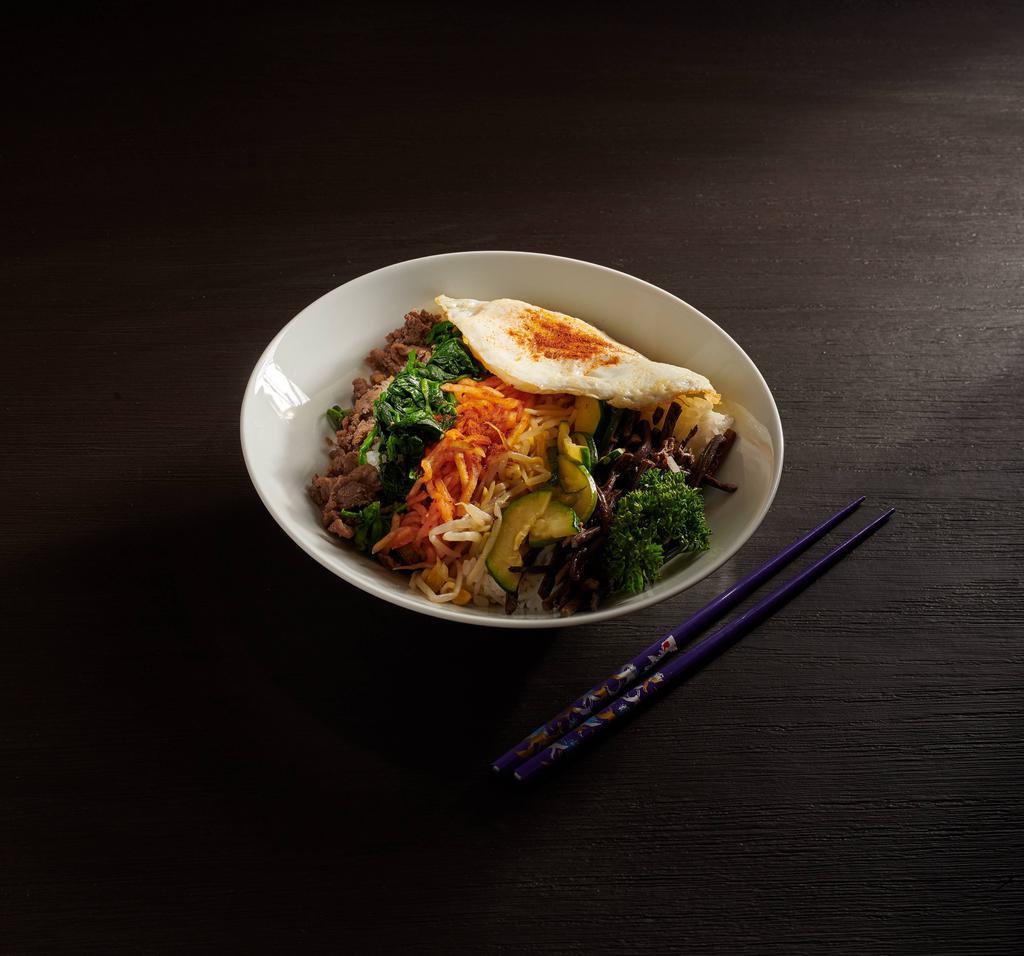  Bi Bim Bob · Steamed white rice mixed with red pepper sauce, vegetables, beef and fried egg. 