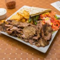 Gyro Doner Kebab · Thinly-sliced lamb and beef grilled on a spinning vertical split. Served with potato wedges,...