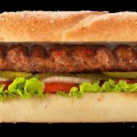 Adana (Long kofteh) Sandwich · Ground lamb and beef meat, tomatoes, lettuce, onions. Served with potato wedges and white sa...