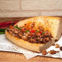 Lamb Sandwich · Marinated chopped lamb with peppers. Served with potato wedges.