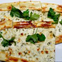 White Feta Cheese Pide · Thick dough crust topped with feta cheese and parsley.
