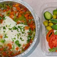 Shakshuka · Tomatoes, red bell peppers, green bell peppers, onions and sunny side up eggs.