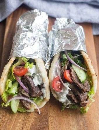 Beef Gyro  · Fresh local beef served in hot pita bread. Served with Tomatoes, lettuce, onions, green peppers and house made  taztiki, garlic and hot sauce.