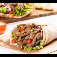 Beef Shawarma Wrap · Fresh local beef delicately sliced & seasoned in house. Served in 12