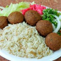 Falafel Plate Over Rice (Vegetarian & Vegan)  · Our falafel is made from scratch with garbanzo beans and spices. 10 Falales served with rice...