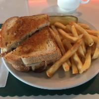 Patty Melt · Juicy beef patty broiled, topped with melted Swiss cheese and grilled onions on rye bread.