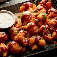 Nashville Hot Cauliflower · Crispy-fried cauliflower drizzled with Nashville hot sauce and served with a side of ranch d...