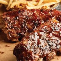 Brick House Famous BBQ Ribs · Pork loin Texas ribs, beer-braised, and slow smoked with house-made whiskey barbeque sauce. ...
