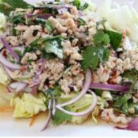 Larb Salad · Choice of chicken or pork. Minced chicken tossed with spicy lime dressing, red onions, dried...