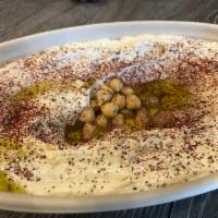 Hummus Plate · Cooked, mashed chickpeas, blended with tahini, olive oil, lemon juice, salt and garlic.