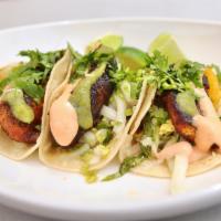 Fish Tacos · three corn tortillas, citrus fennel slaw, tomatillo salsa, sriracha aioli, cilantro