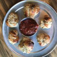 Garlic Knots · Hand crafted garlic knots smothered in garlic oil and finished with fresh garlic, herbs and ...